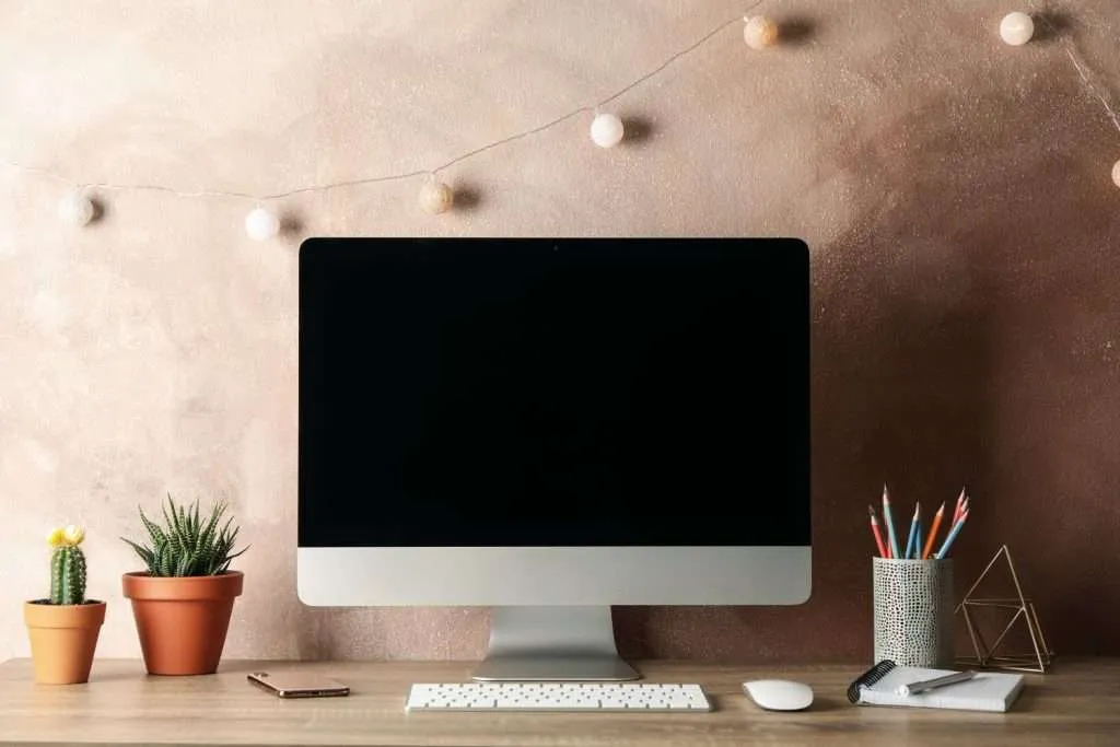 marketing-automation-efficiency-featured Glowing interconnected gears and light paths routing small task tokens automatically above a laptop