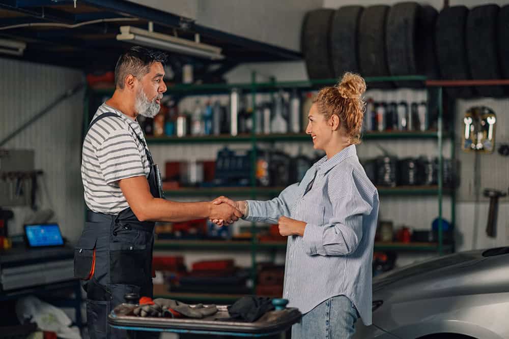 auto-mechanic-and-client-shaking-hands